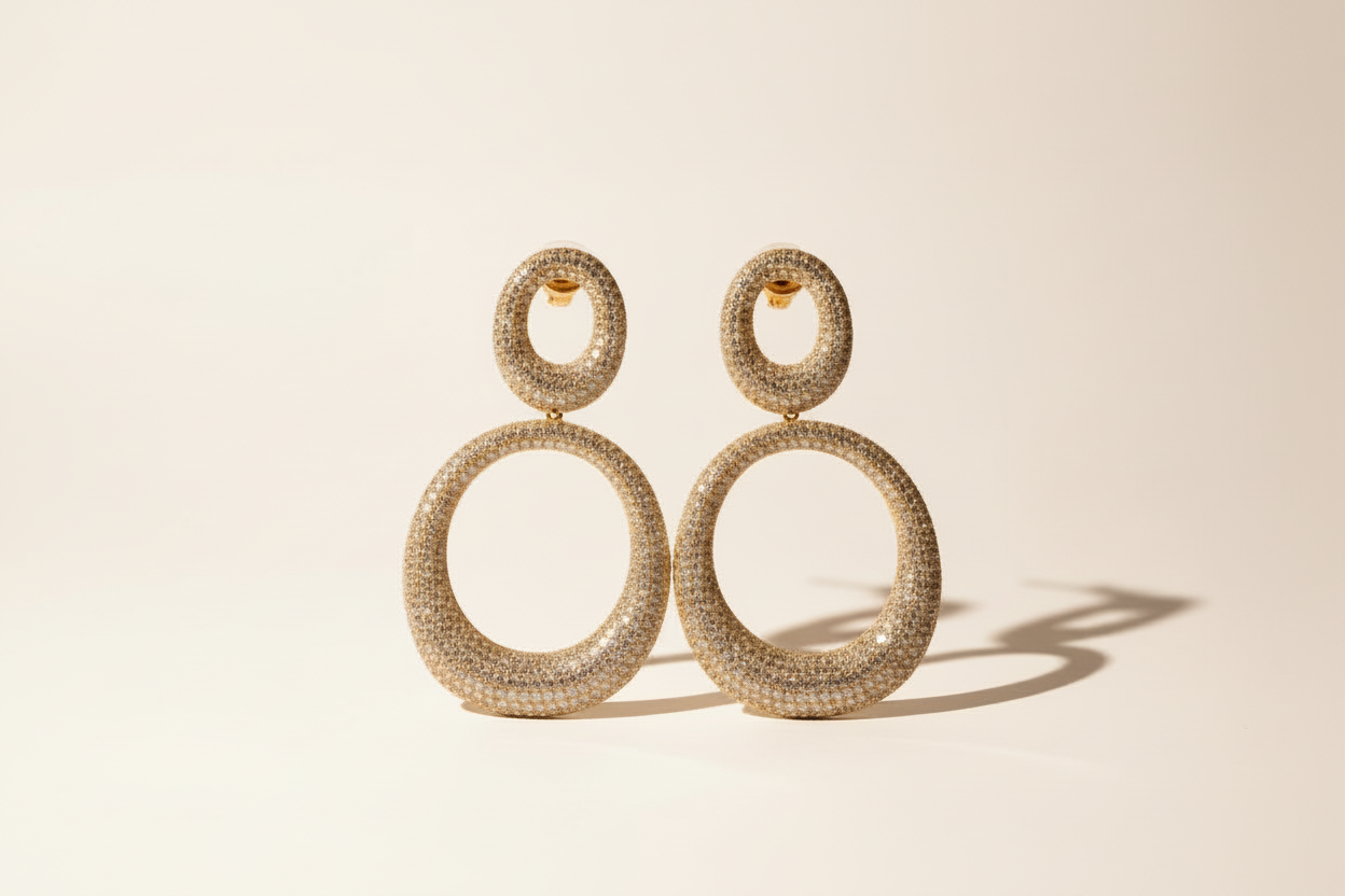 Pair of round earrings with sparkling lab grown diamonds from A PERDIFIATO on a white background